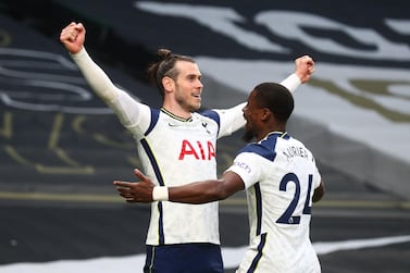 Soccer Football - Premier League - Tottenham Hotspur v Southampton - Tottenham Hotspur Stadium, London, Britain - April 21, 2021 Tottenham Hotspur's Gareth Bale celebrates scoring their first goal with Serge Aurier Pool via REUTERS/Clive Rose EDITORIAL USE ONLY. No use with unauthorized audio, video, data, fixture lists, club/league logos or 'live' services. Online in-match use limited to 75 images, no video emulation. No use in betting, games or single club /league/player publications. Please contact your account representative for further details.