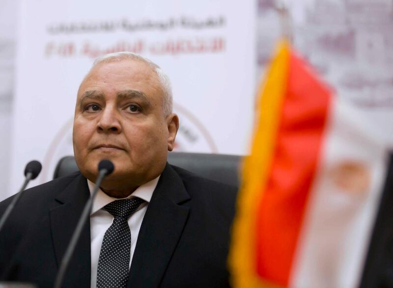 FILE - In this Jan. 8, 2018, file, photo, Lasheen Ibrahim, head of the National Electoral Commission, which is in charge of supervising the 2018 Egyptian presidential election, and members of the commission prepare to give a press conference at the commission headquarters in Cairo, Egypt. Egypt will hold Senate elections over two days in August, the chief of the countryâ€™s election commission said Saturday, July 4, 2020, more than a year after the restoration of Parliamentâ€™s lower chamber, which was dissolved in 2014. Ibrahim, chairman of the National Election Authority, told a televised news conference that Senate elections will be held Aug. 11-12, with runoff elections to take place Sept. 8-9 if necessary. (AP Photo/Amr Nabil, File)