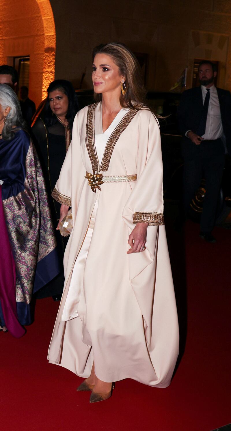 Queen Rania wears a gold and cream abaya to attend a private dinner at the Al Husseiniya Palace in Amman. Reuters