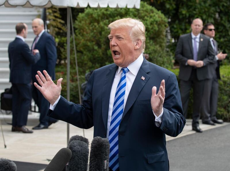 President Donald Trump tells reporters a time and place for his meeting with North Korea's Kim Jong Un has been set and will be announced soon, as he leaves for Dallas to address the National Rifle Association, in Washington, Friday, May 4, 2018. (AP Photo/J. Scott Applewhite)