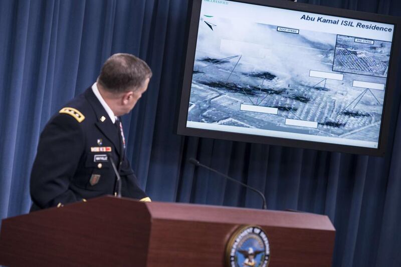 Lt Gen William Mayville, US joint staff director of operations, shows images of airstrikes in Syria during a briefing at the Pentagon on September 23 in Washington, DC. Brendan Smialowski/AFP Photo