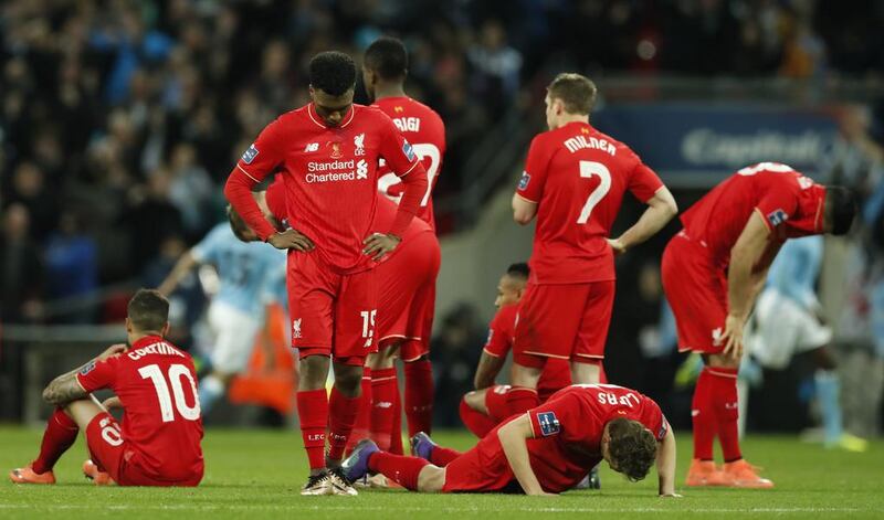 Liverpool players are dejected during the penalty shoot-out. Action Images via Reuters / John Sibley