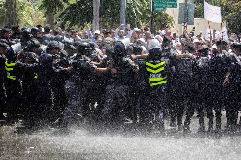 Jordanian teachers clash with security forces during a protest in the capital Amman.  AFP