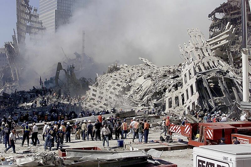 Fire and rescue workers search through the rubble of the World Trade Center in New York on September 13, 2001. EPA