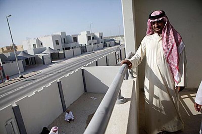 Ali Al Hajery tours his new villa in Al Falah after picking up the keys yesterday.