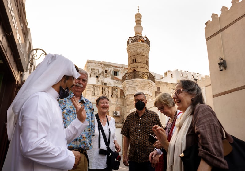 A Saudi guide shows American tourists round Al Shaf'i Mosque in the Old City of Jeddah. AP