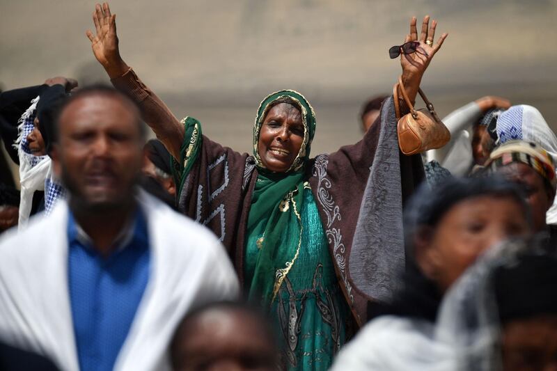 A distraught relative reacts as she arrives at the crash site. AFP