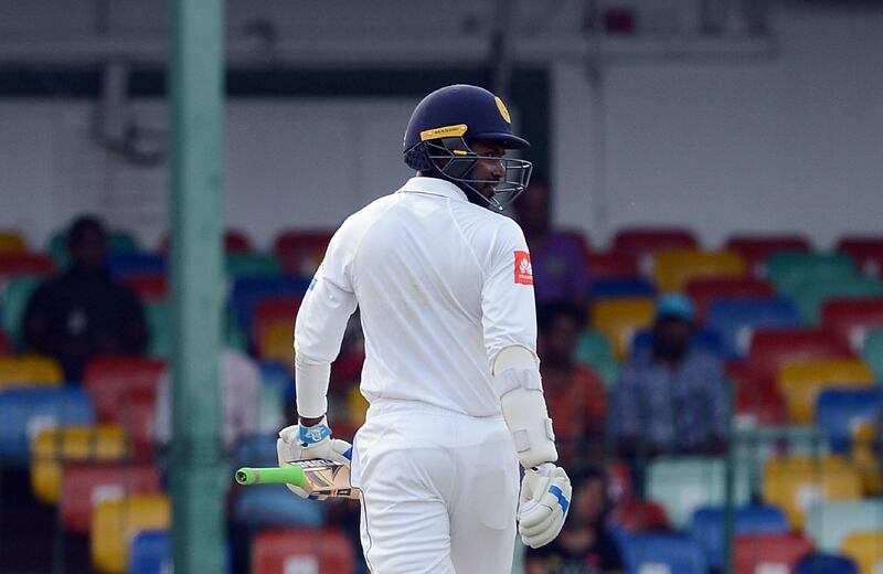 Sri Lankan cricketer Upul Tharanga walks back to the pavilion after his dismissal during the second day of the second Test match between Sri Lanka and India at the Sinhalese Sports Club (SSC) Ground in Colombo on August 4, 2017. / AFP PHOTO / LAKRUWAN WANNIARACHCHI