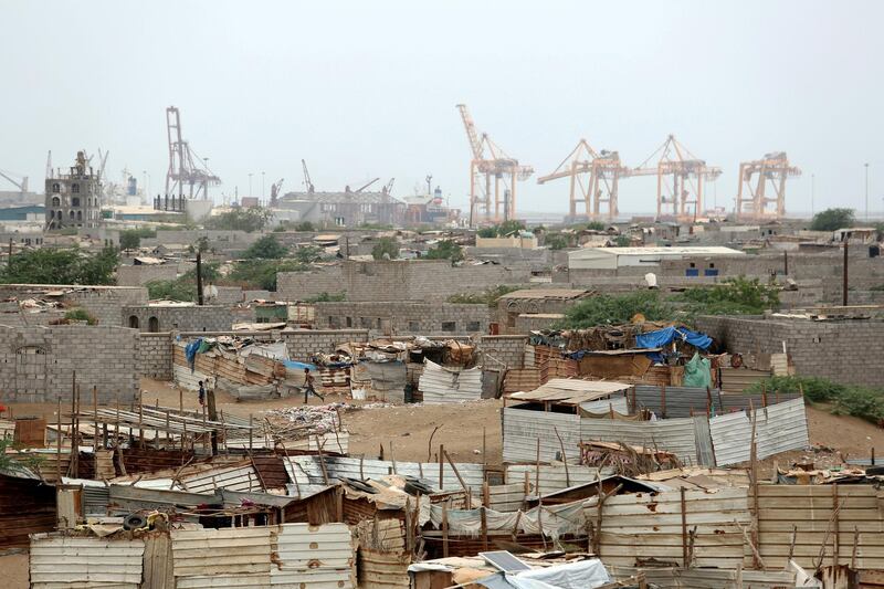 FILE PHOTO: FILE PHOTO: Hodeidah port's cranes are pictured from a nearby shantytown in Hodeidah, Yemen June 16, 2018. REUTERS/Abduljabbar Zeyad/File Photo