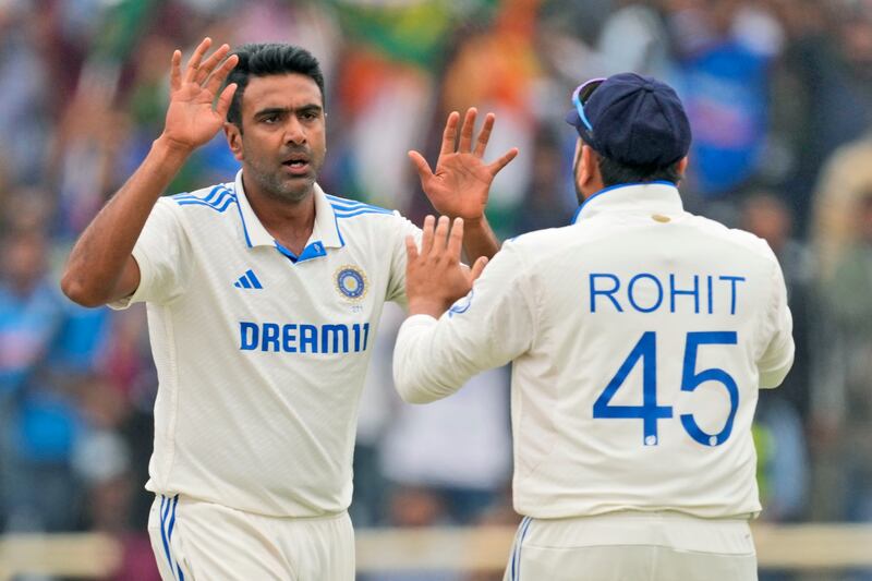 India's Ravichandran Ashwin celebrates with captain Rohit Sharma after claiming the wicket of England's Ollie Pope for a first-ball duck. AP