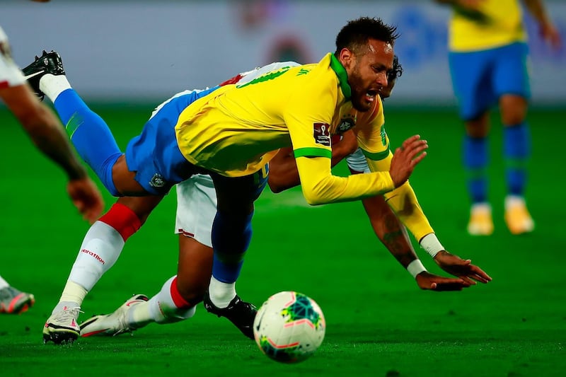 Neymar and Peru's Renato Tapia fall. AFP