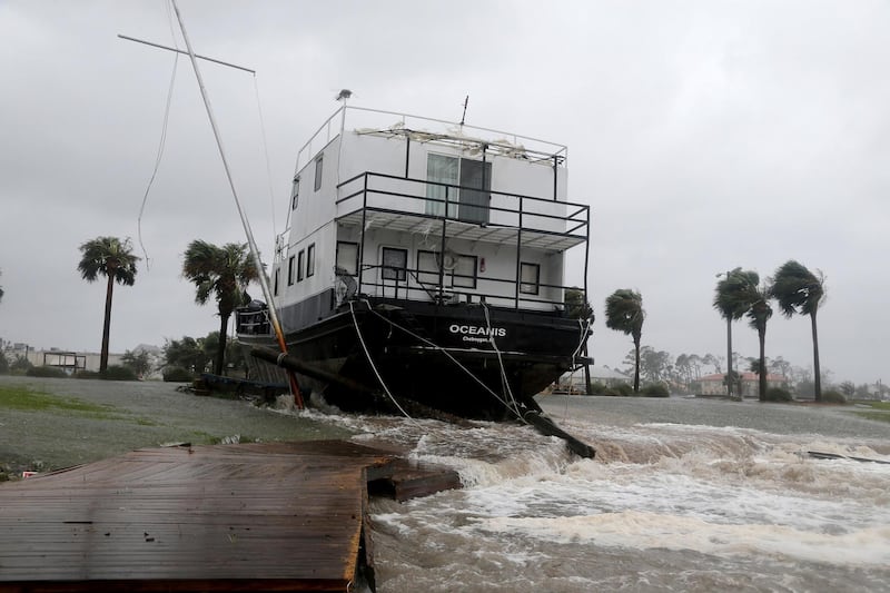 The Oceanis is grounded by a tidal surge at the Port St Joe Marina, Florida. AP Photo