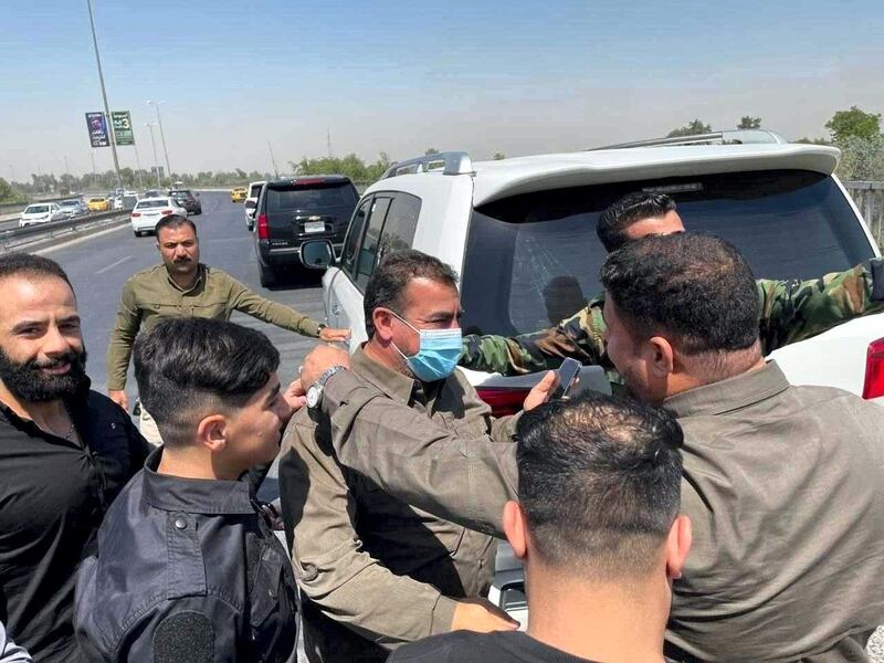 Iraqi militia commander Qassim Musleh is pictured with supporters following his release from Iraqi government custody.