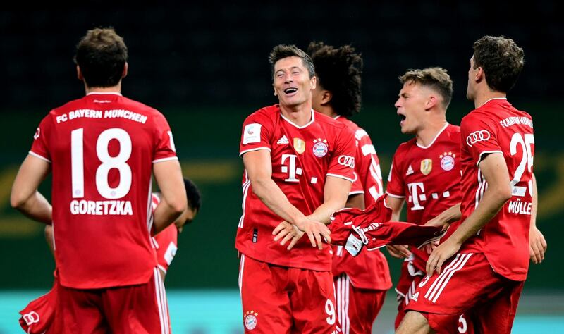 Robert Lewandowski and teammates celebrate winning the German Cup. Reuters