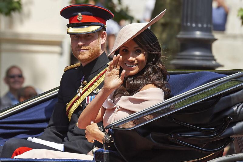 Britain's Prince Harry, Duke of Sussex and Britain's Meghan, Duchess of Sussex return in a horse-drawn carriage after attending the Queen's Birthday Parade, 'Trooping the Colour' on Horseguards parade in London.
The ceremony of Trooping the Colour is believed to have first been performed during the reign of King Charles II. In 1748, it was decided that the parade would be used to mark the official birthday of the Sovereign. More than 600 guardsmen and cavalry make up the parade, a celebration of the Sovereign's official birthday, although the Queen's actual birthday is on 21 April. AFP / Niklas HALLEN