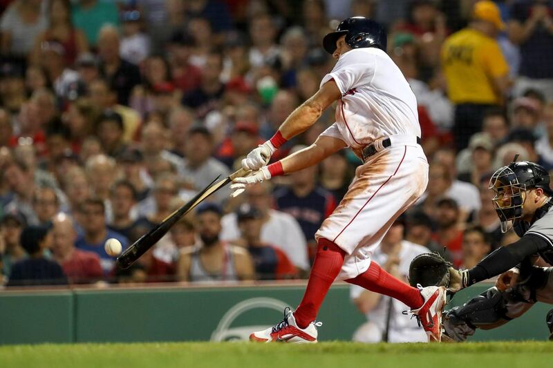 Boston Red Sox second baseman Ian Kinsler hits for a double against the New York Yankees at Fenway Park. Paul Rutherford USA TODAY Sports