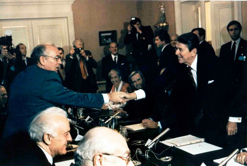Soviet leader Mikhail Gorbachev, left, shakes hands with Ronald Reagan, the US president at the time, at the Geneva conference in November 1985. AP