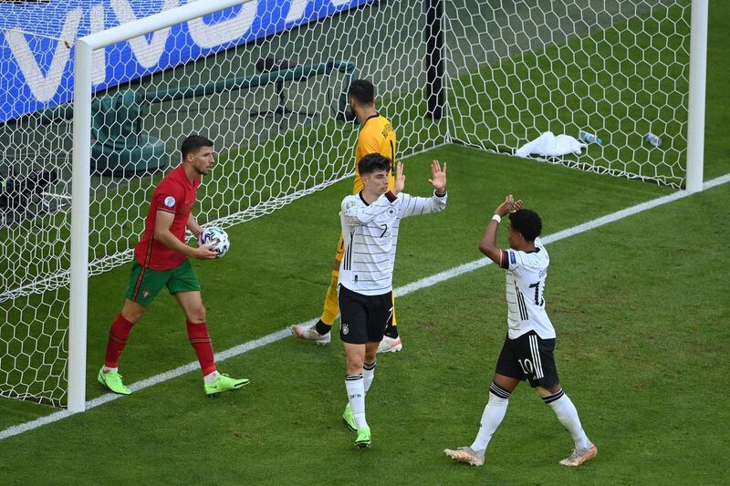 Germany forward Kai Havertz (L) celebrates scoring their third goal with midfielder Serge Gnabry. AFP