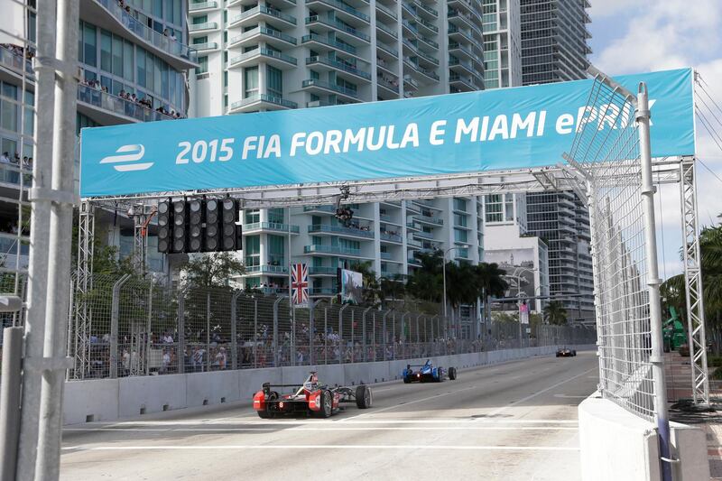 FILE - In  this March 14, 2015, file photo, cars race on downtown Miami streets during the Formula E Miami ePrix auto race, in Miami. Formula One has announced plans for a street race in Miami starting in 2019. Miami city officials are scheduled to vote next week on a plan to stage a race the series has long coveted as it seeks to enlarge its presence in the United States. A Miami race would be the second in the U.S., joining the U.S. Grand Prix in Austin, Texas. (AP Photo/Wilfredo Lee, File)