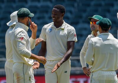 South Africa's bowler Kagiso Rabada, centre, is congratulated after dismissing Pakistan's Faheem Ashraf on day four of the third cricket test match between South Africa and Pakistan at Wanderers Stadium in Johannesburg, South Africa, Monday, Jan. 14, 2019. (AP Photo/Christiaan Kotze)