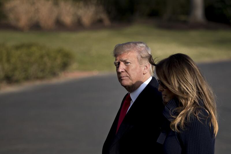 U.S. President Donald Trump and First Lady Melania Trump, right, walk toward the White House in Washington, D.C., U.S., on Monday, March 19, 2018. Trump unveiled a new plan to combat the opioid epidemic today in New Hampshire, including tougher punishments, in some cases the death penalty, for those selling drugs illegally. Photographer: Andrew Harrer/Bloomberg