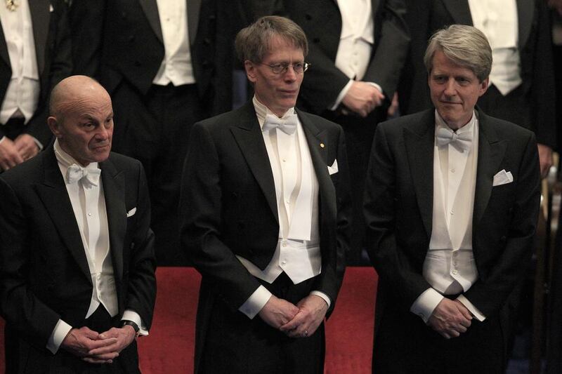 From left, Eugene Fama, Lars Hansen and Robert Shiller accept the 2013 Nobel. Frank Augstein / AP Photo