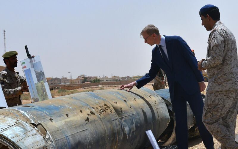 Brian Hook (2nd R), the US special representative on Iran, checks what Saudi officials said were Iranian remnants of a "cruise missile" that slammed into Abha airport on June 12, during a visit to an army base in al-Kharj, south of the Saudi capital Riyadh, on June 21, 2019. The US said Iran has no right to respond to diplomacy "with military force", a day after Washington said Tehran shot down a US drone over the Strait of Hormuz. "Our diplomacy does not give Iran the right to respond with military force," Hook, told reporters in Saudi Arabia.
 / AFP / Fayez Nureldine
