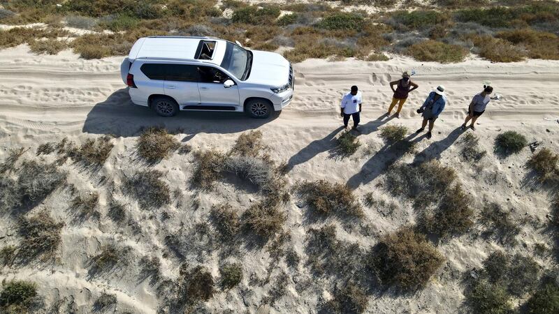 RAK, UNITED ARAB EMIRATES , January 20 – Mohammed (left) with his 4x4  lives near the Pink Lake which discovered in Ras Al Khaimah. Some visitors are coming to see this lake after some pictures appeared on the social media recently. (Pawan Singh / The National) For News/Stock/Online/Instagram/Standalone/Big Picture. Story by Kelly