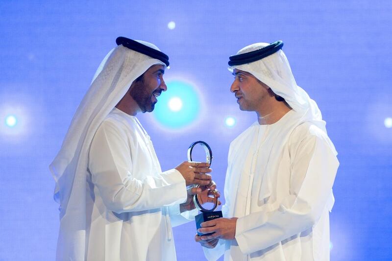 UAE poet Jumaa Al Ghuwais receives the award from Sheikh Hazza bin Zayed. The poems of Mr Al Ghuwais are recited by young and old alike as part of the UAE’s National Day celebrations, and his This is our Country and Zayed’s Home reflect the national pride of the country’s people. Ryan Carter / Crown Prince Court — Abu Dhabi