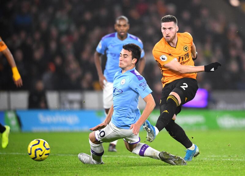 WOLVERHAMPTON, ENGLAND - DECEMBER 27: Matt Doherty of Wolverhampton Wanderers scores his sides third goal  during the Premier League match between Wolverhampton Wanderers and Manchester City at Molineux on December 27, 2019 in Wolverhampton, United Kingdom. (Photo by Clive Mason/Getty Images)