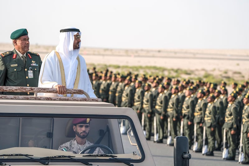 ZAYED MILITARY CITY, ABU DHABI, UNITED ARAB EMIRATES - November 28, 2017: HH Sheikh Mohamed bin Zayed Al Nahyan Crown Prince of Abu Dhabi Deputy Supreme Commander of the UAE Armed Forces (2nd L), inspects the cadets during a graduation ceremony for the 8th cohort of National Service recruits and the 6th cohort of National Service volunteers at Zayed Military City. Seen with Brigadier Faisal Mohamed Al Shehhi (L).

( Hamad Al Kaabi / Crown Prince Court - Abu Dhabi )
—