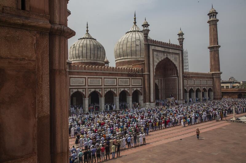 Indian Muslims offer congregational Friday prayers at the Jama Masjid (Grand Mosque) amid the government imposing restriction on assembly of more than 20 people over the coranavirus threat in Delhi. Getty Images