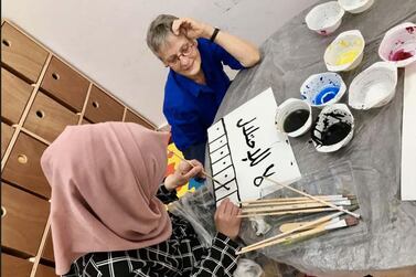 Marie-Claude Quignon, a French visual artist , working in a Palestinian refugee camp. Courtesy Marie-Claude Quignon