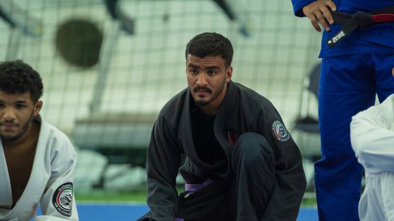 Hamad Nawad goes through his workout watched by coach Ramon Lemos at the resident camp at the Armed Forces Club in Abu Dhabi. Courtesy UAEJJF May, 2020.