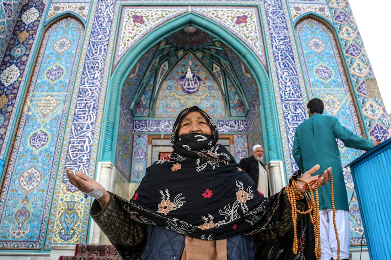 A woman visits a shrine in Kabul to celebrate Nowruz. EPA