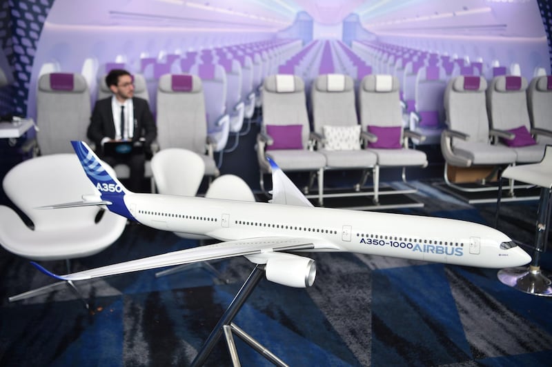 A scale model of an Airbus A350-1000 passenger aircraft is seen at the International Air Transport Association (IATA) annual meeting in Sydney on June 5, 2018. / AFP / PETER PARKS
