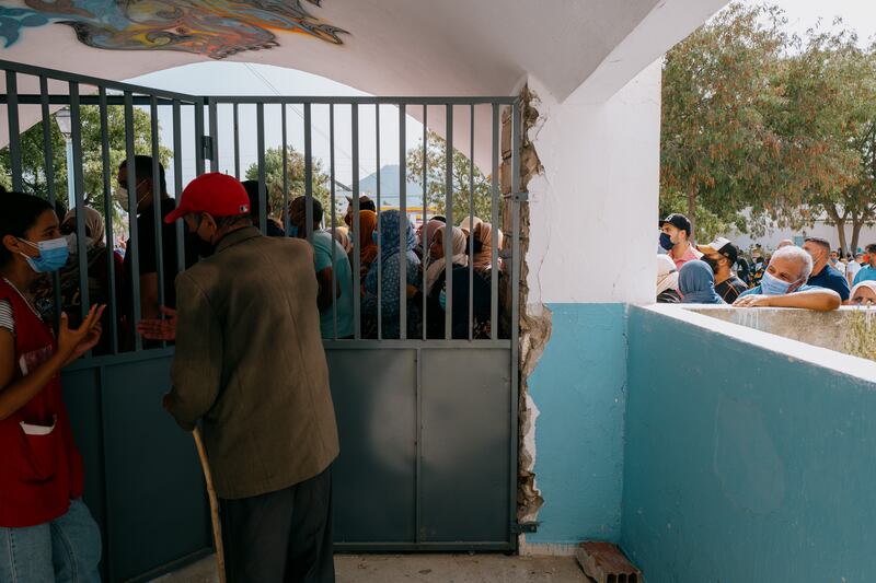 Technical troubles meant hundreds of people waited in the heat to get into the vaccine centre in Mornag.