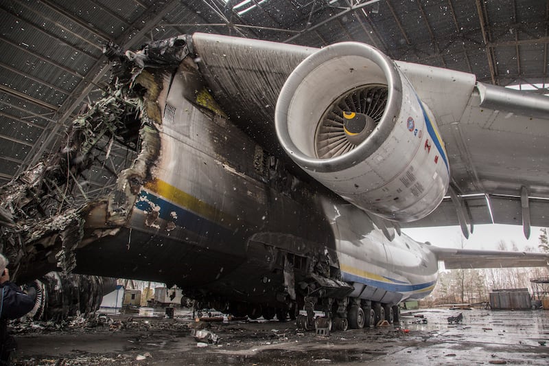 The wreckage of an Antonov AN-225, the world's biggest aircraft, sits under a steel shelter at Gostomel airfield near Kyiv in April 2022. EPA