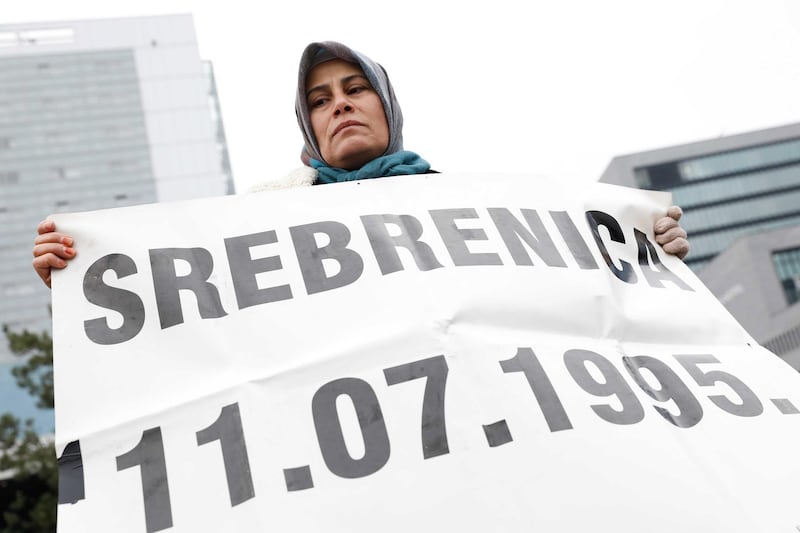 A woman protests outside the Yugoslav War Crimes Tribunal during the verdict reading against Bosnian Serb military chief Ratko Mladic in The Hague, The Netherlands, November 22, 2017. EPA