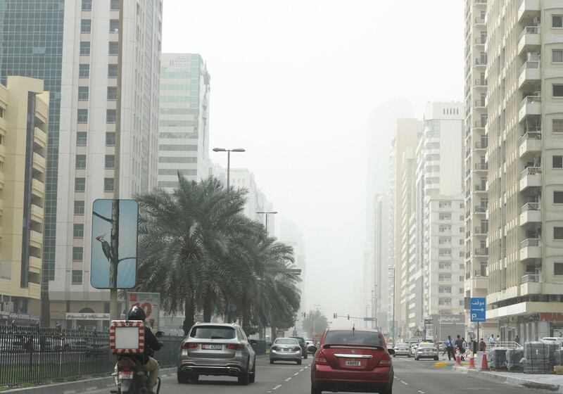 Abu Dhabi, United Arab Emirates - Poor visibility in the city of Abu Dhabi. Khushnum Bhandari for The National