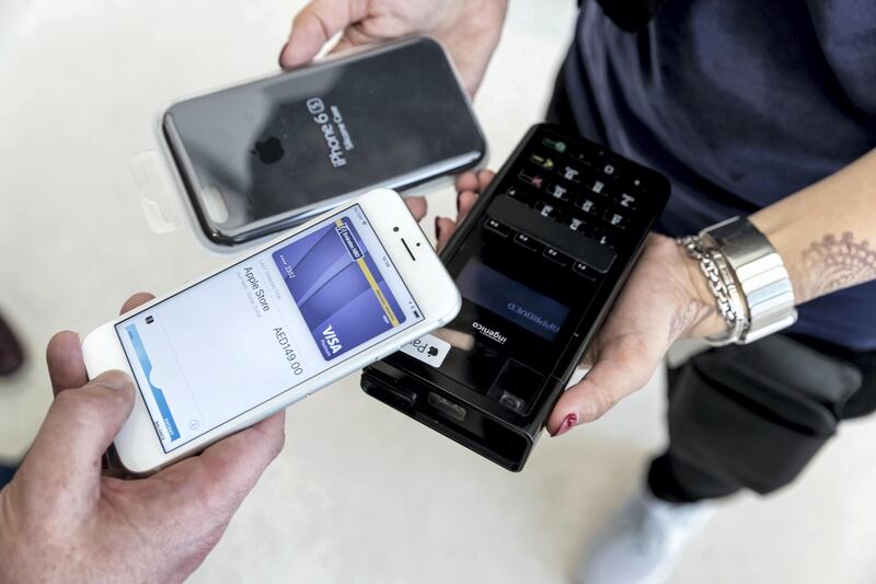 DUBAI, UNITED ARAB EMIRATES. 24 October 2017. Apple Pay launched in the UAE. Used to purchase an Iphone Cover at the Apple Store in Dubai Mall. (Photo: Antonie Robertson/The National) Journalist: Caline Malek. Section: National.