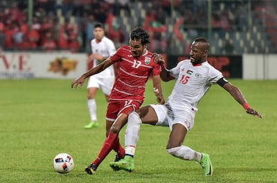 Abdelatif Bahdari (R) of Palestine fights for the ball with Ahmed Shafiu (L) of the Maldives during the AFC Asian Cup qualifiers football match between Palestine and the Maldives in Male on March 28, 2017. (Photo by - / AFP)