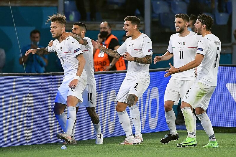 Ciro Immobile (L) of Italy celebrates with teammates after scoring the second. EPA