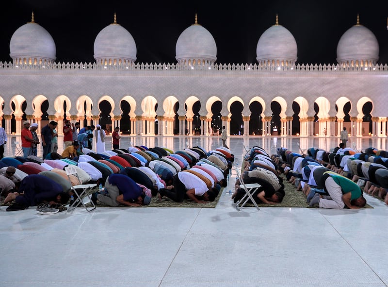 Isha prayers held at the mosque. Victor Besa / The National