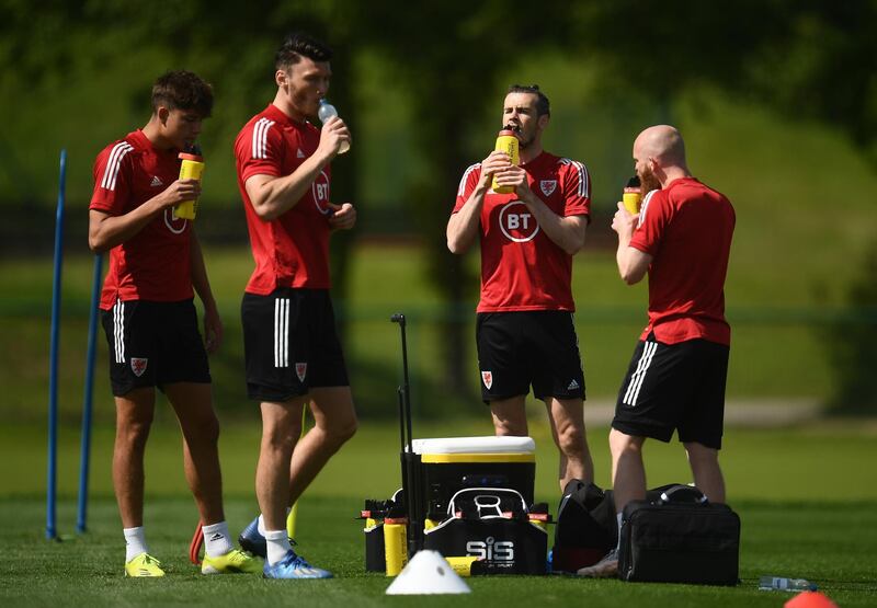 Left to right: Rubin Colwill, Kieffer Moore, Gareth Bale and Jonny Williams. Getty