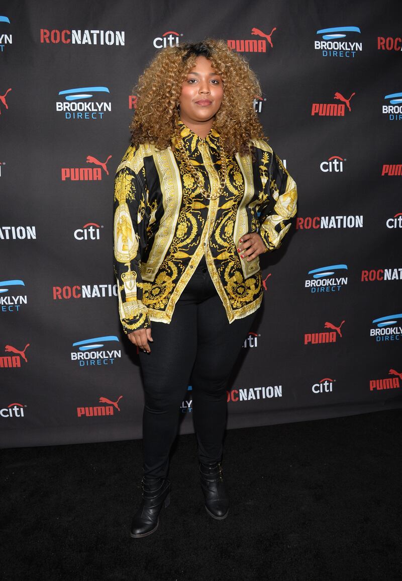 Lizzo arrives in a gold-edged blazer at the Roc Nation Grammy Brunch 2015 in Beverly Hills, California. Photo: WireImage