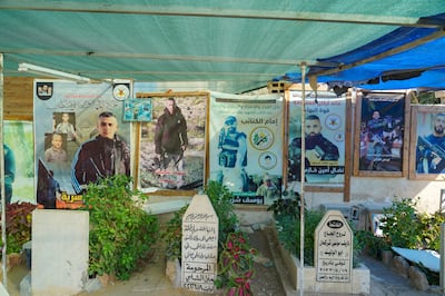 Posters of dead Palestinian fighters line the wall of cemetery in Jenin. Willy Lowry / The National