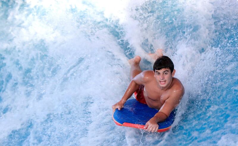 Abu Dhabi, United Arab Emirates, August 4, 2020.   Yas Waterworld Abu Dhabi opens with 30% capacity as Covid-19 restrictions slowly come to an ease.  A body boarder rips the waves at the waterpark.
Victor Besa /The National
Section: NA
Reporter: