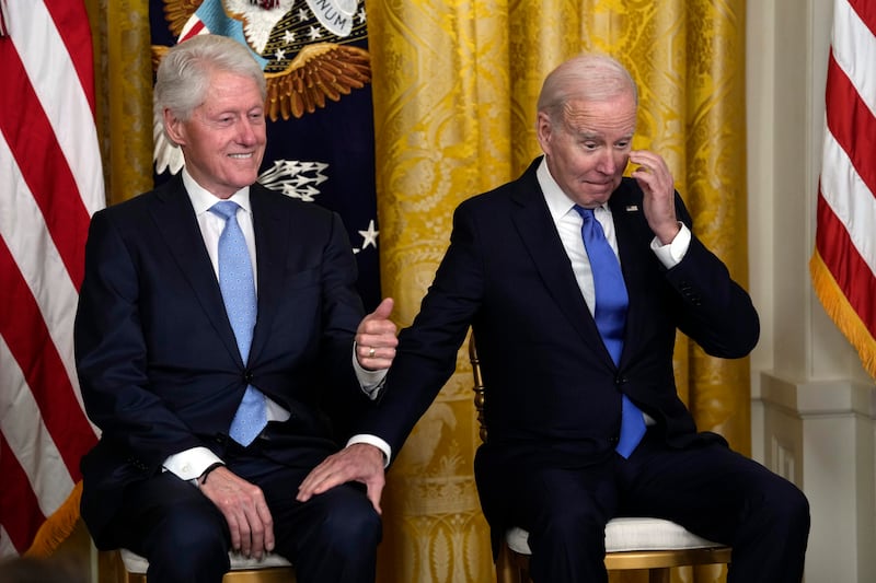 President Joe Biden and former president Bill Clinton have a laugh as Vice President Kamala Harris speaks. AP