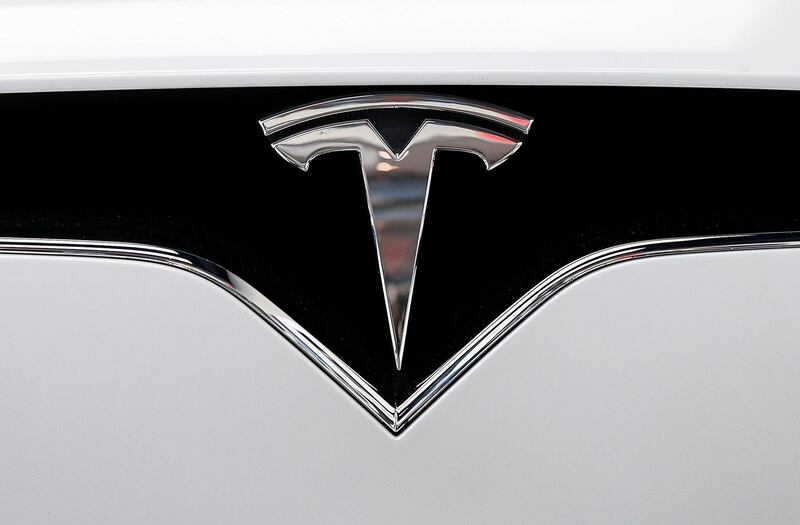 The Tesla logo is seen on a car at Tesla Motors' new showroom in Manhattan's Meatpacking District in New York City, U.S., December 14, 2017. REUTERS/Brendan McDermid